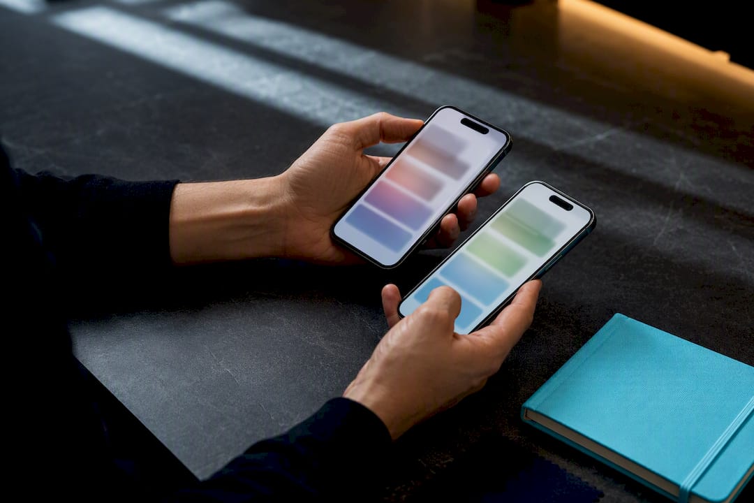 Hands reviewing multilingual app screens