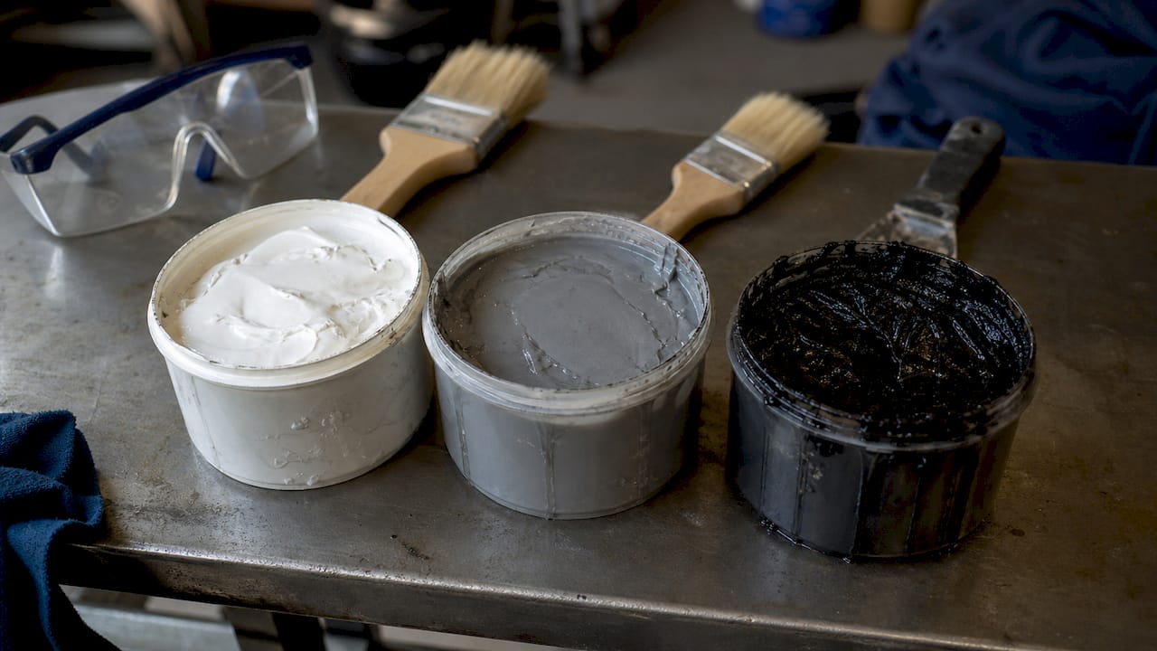 Close-up of various waterproof roof sealant types