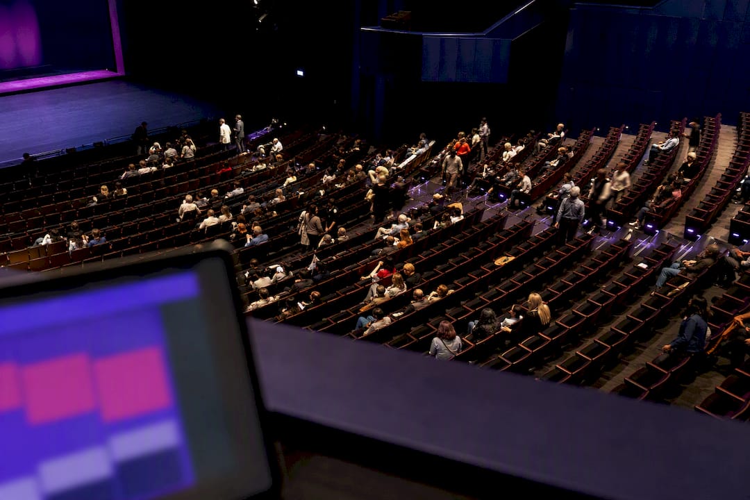 Theater seats showing uneven audience occupancy