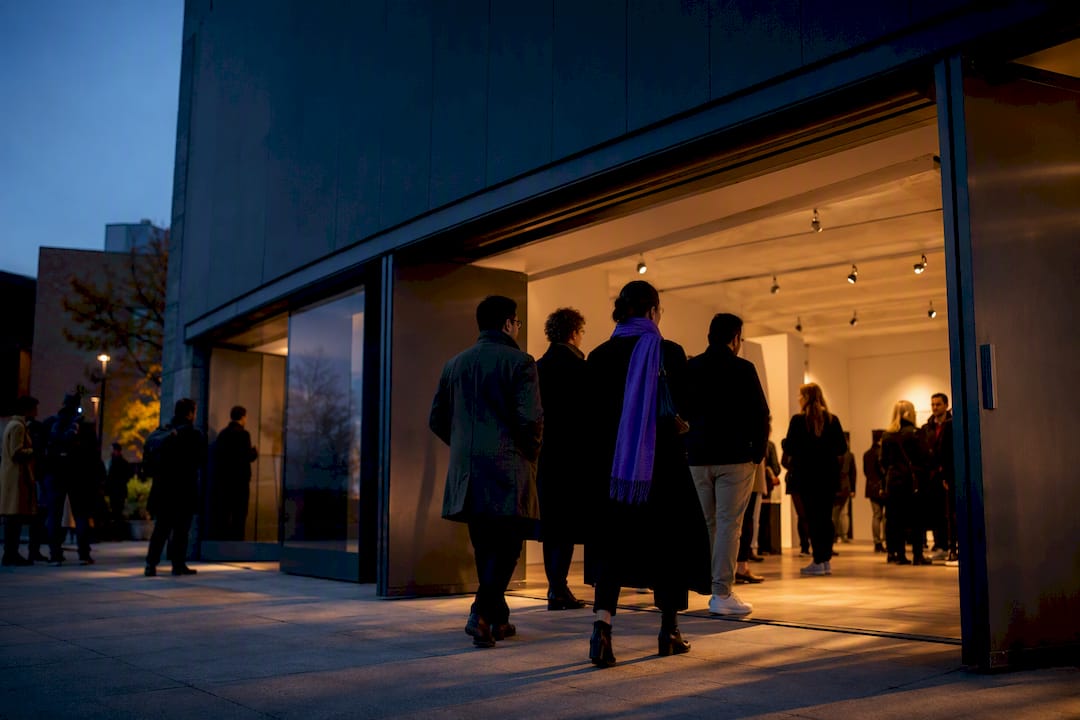 Audience arriving at contemporary arts venue