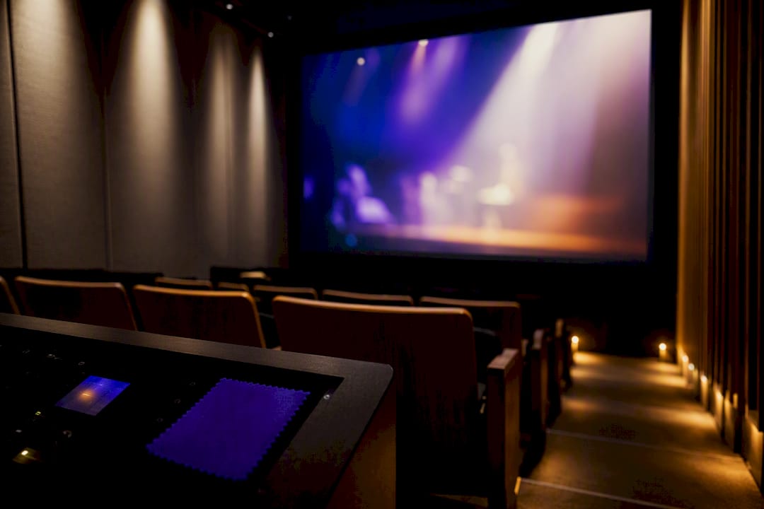 Event trailer playing in cultural venue screening room