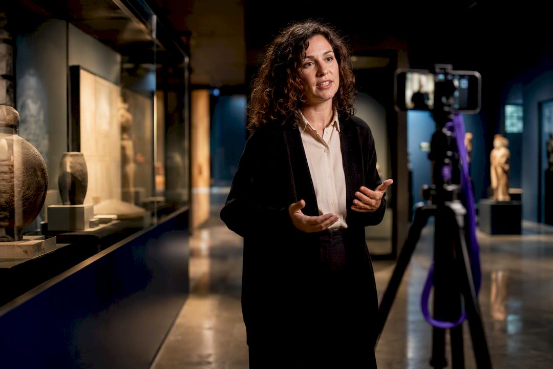 Curator recording museum marketing content