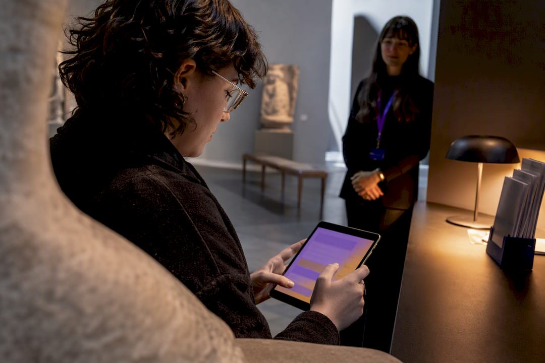 Museum visitor completing an audience survey