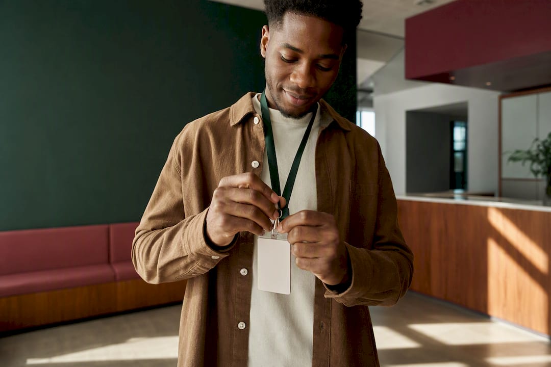 New hire attaching an access badge