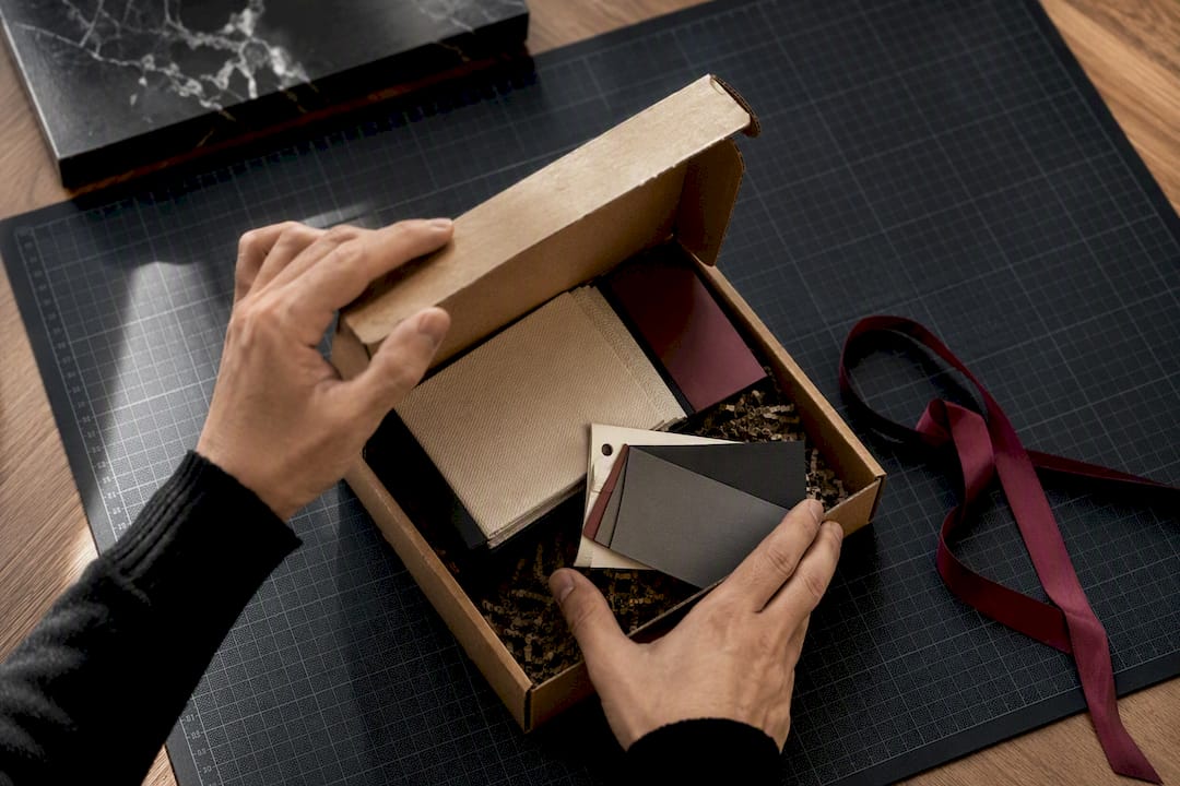 Hands opening a packaging sample shipment
