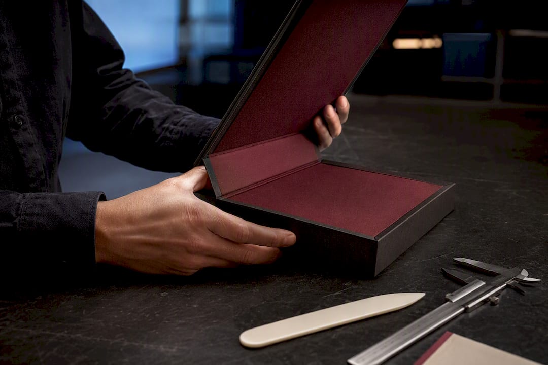 Close-up of book-style box hinge and lining