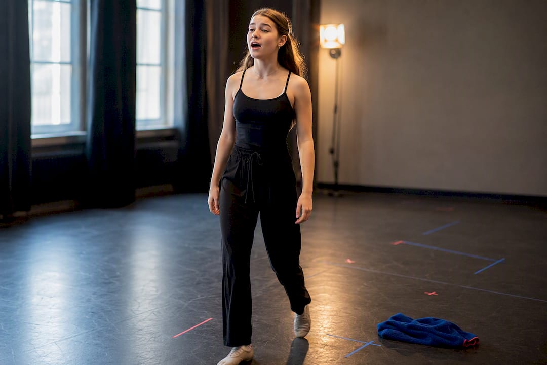 Singer rehearsing vocals while walking blocking