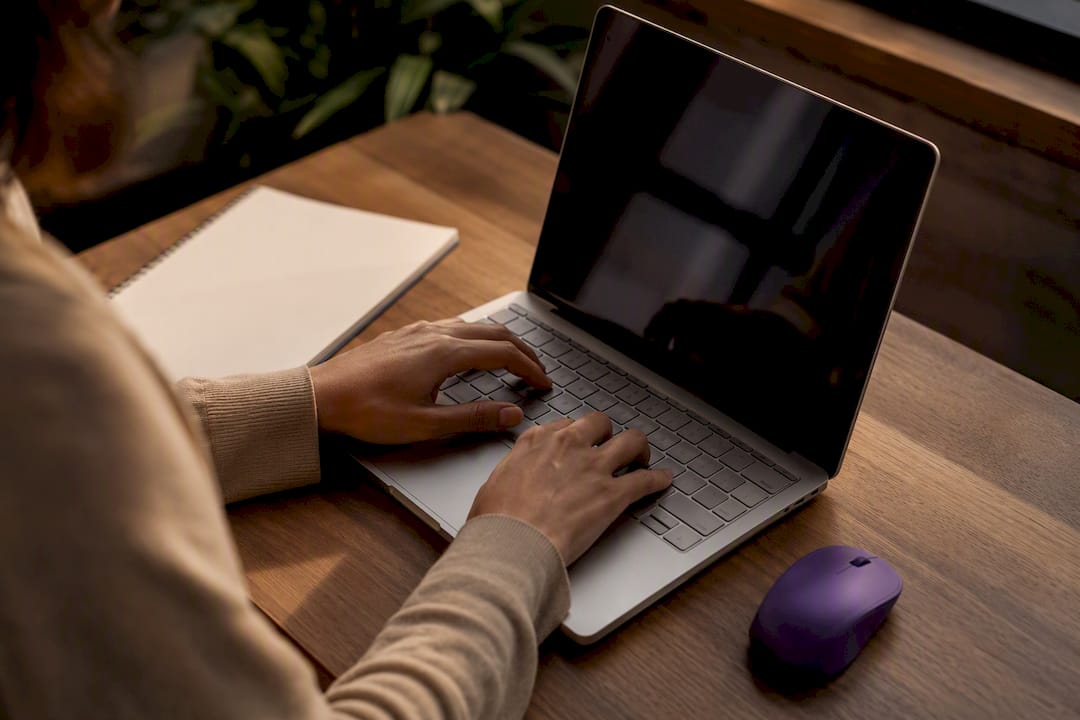 Hands performing manual accessibility QA test