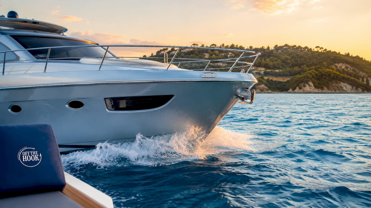 Close-up yacht bow moving through ocean water