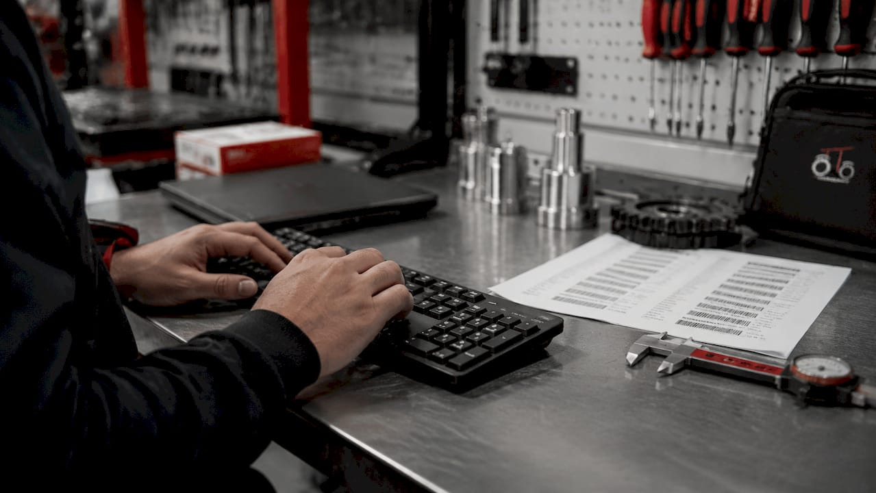 Hands using fitment verification tools on computer