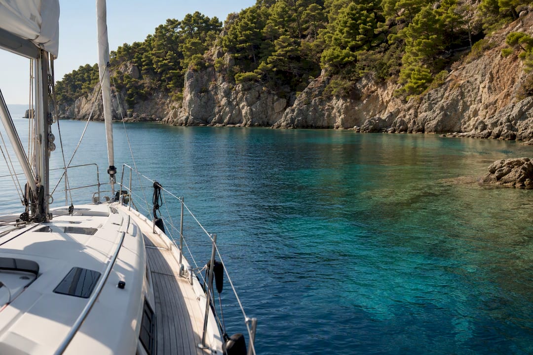 Luxury yacht anchored in secluded Greek cove