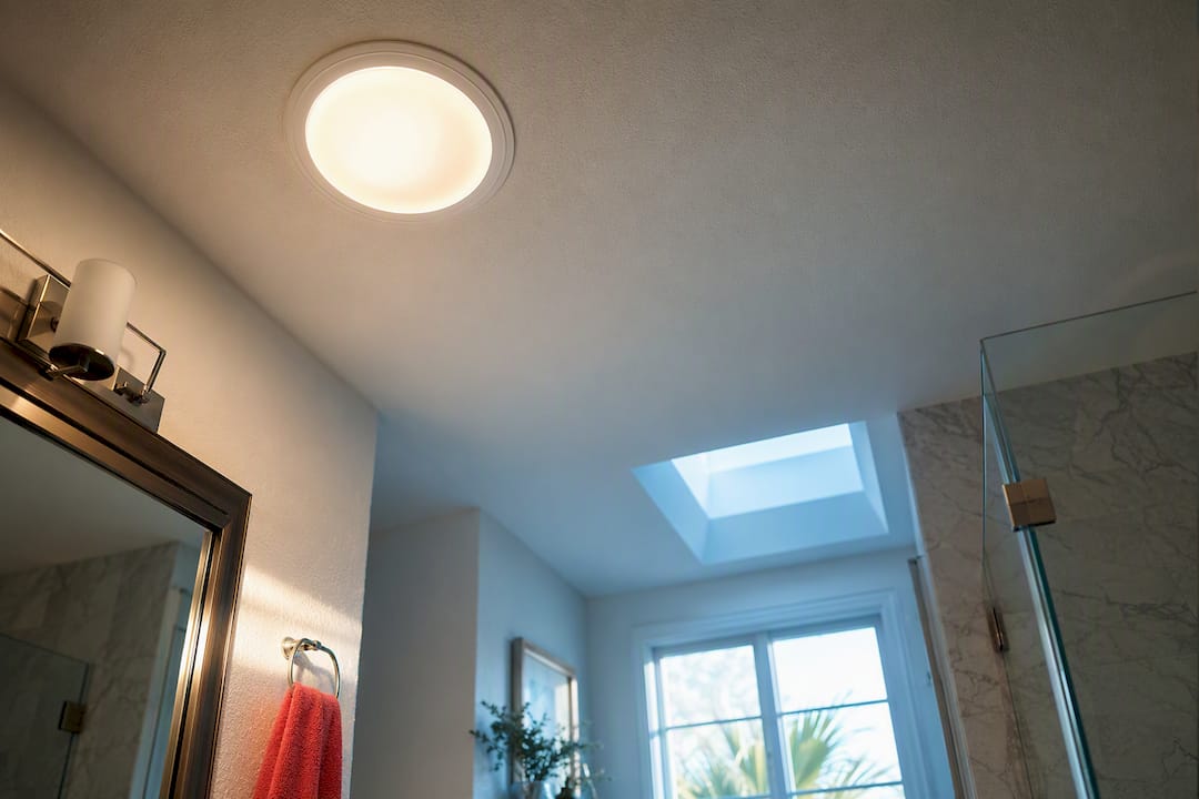 Solar tube diffuser brightening a Florida bathroom