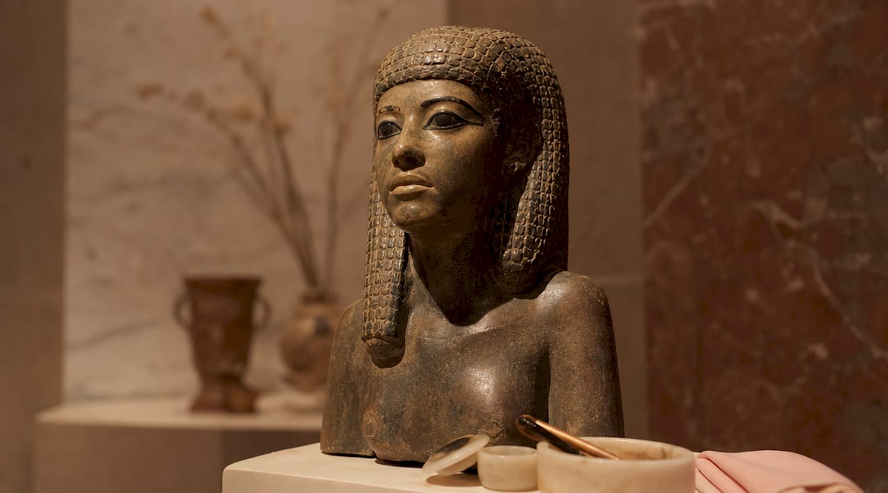 Ancient Egyptian statue with kohl eye makeup detail