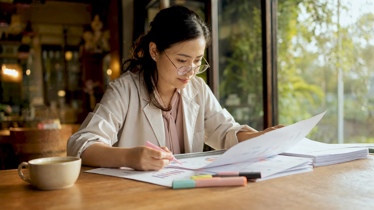 Researcher reviewing makeup clinical trial data