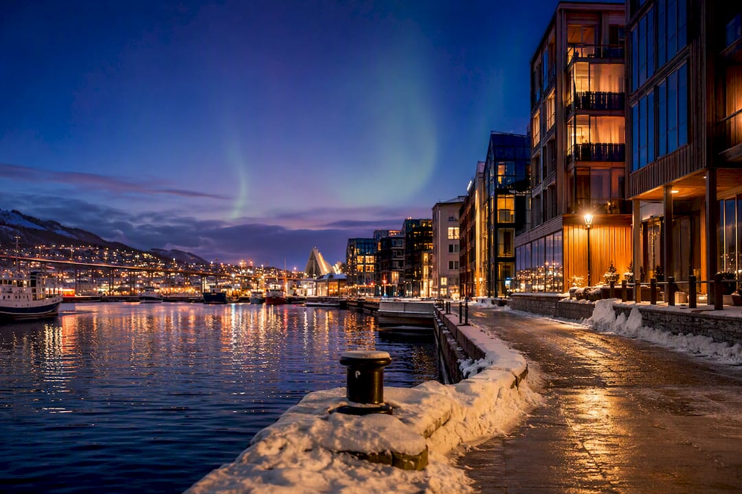 Winter harbor lights in downtown Tromsø