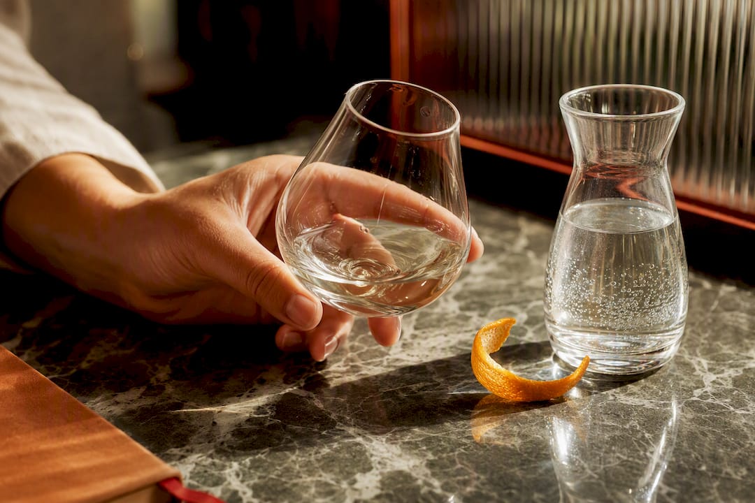 Hand tasting a low-juniper gin sample