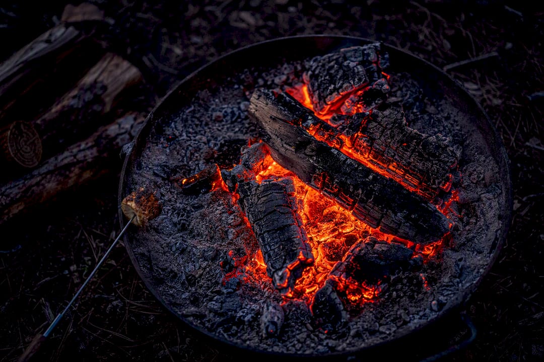 Embers, charred wood, ash and toasted food
