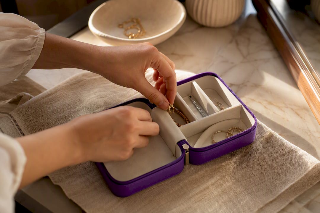 Jewelry pieces separated in fabric storage pouch