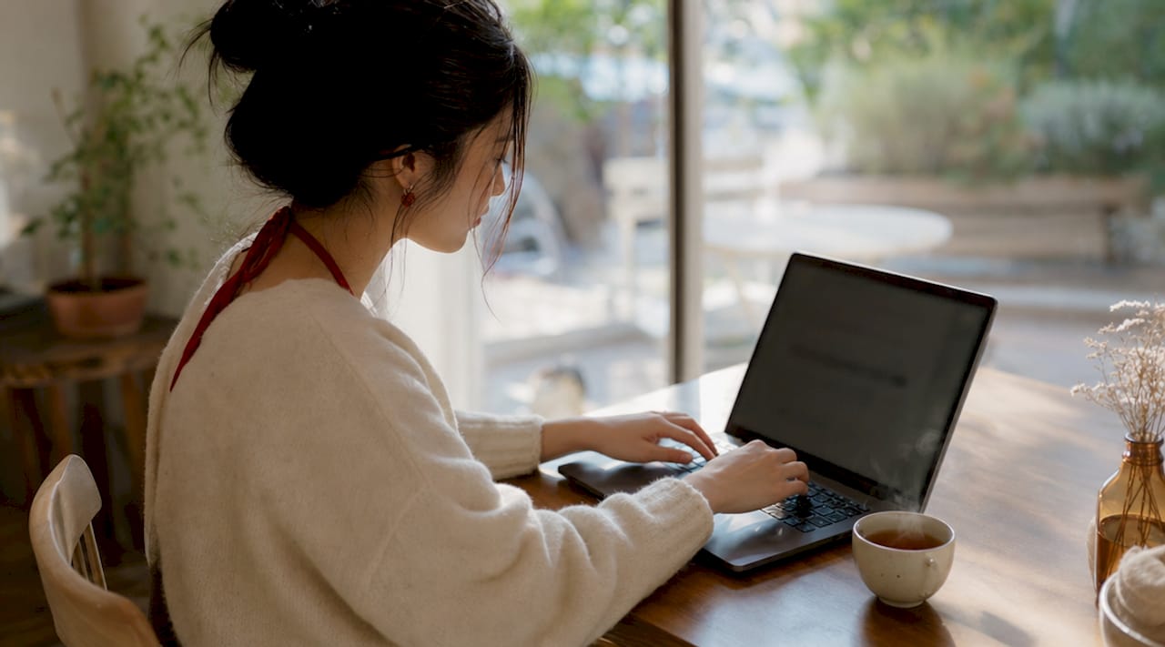 Hands typing laptop for marketing optimisation