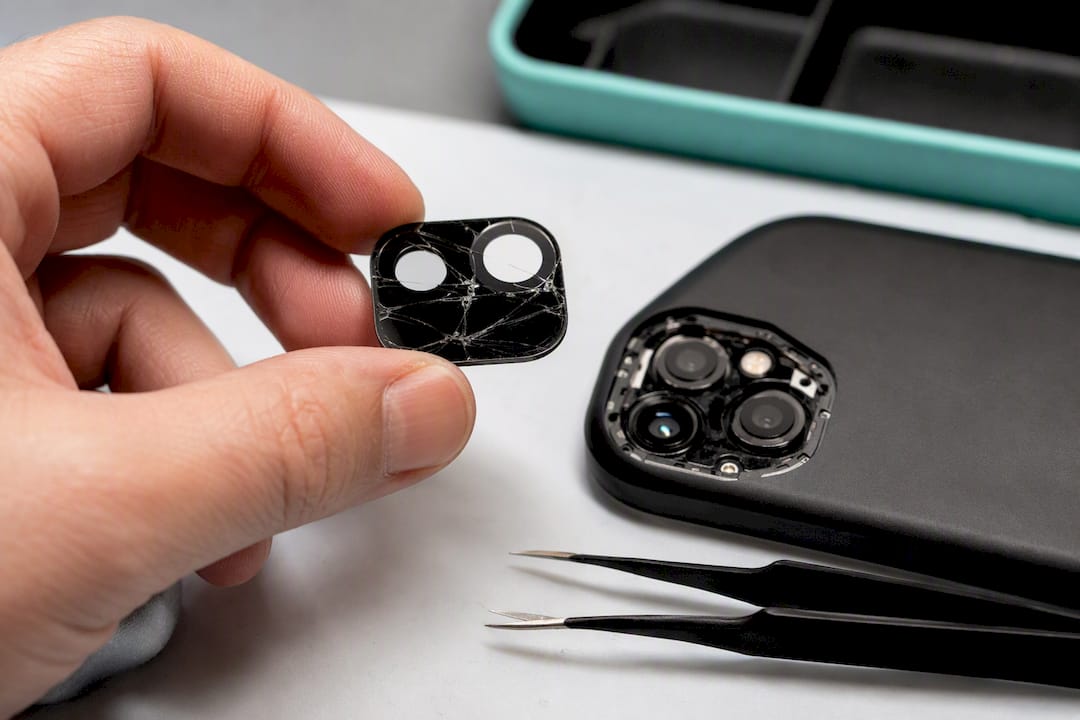 Separated camera glass beside phone housing