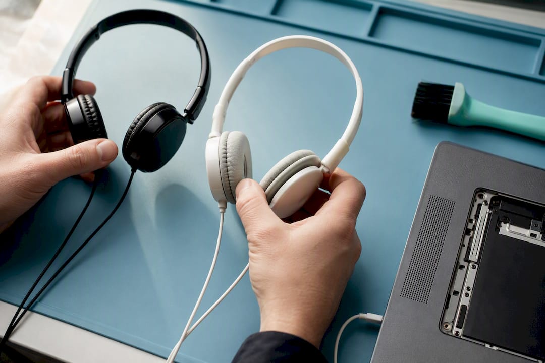 Headphones beside cropped speaker grille