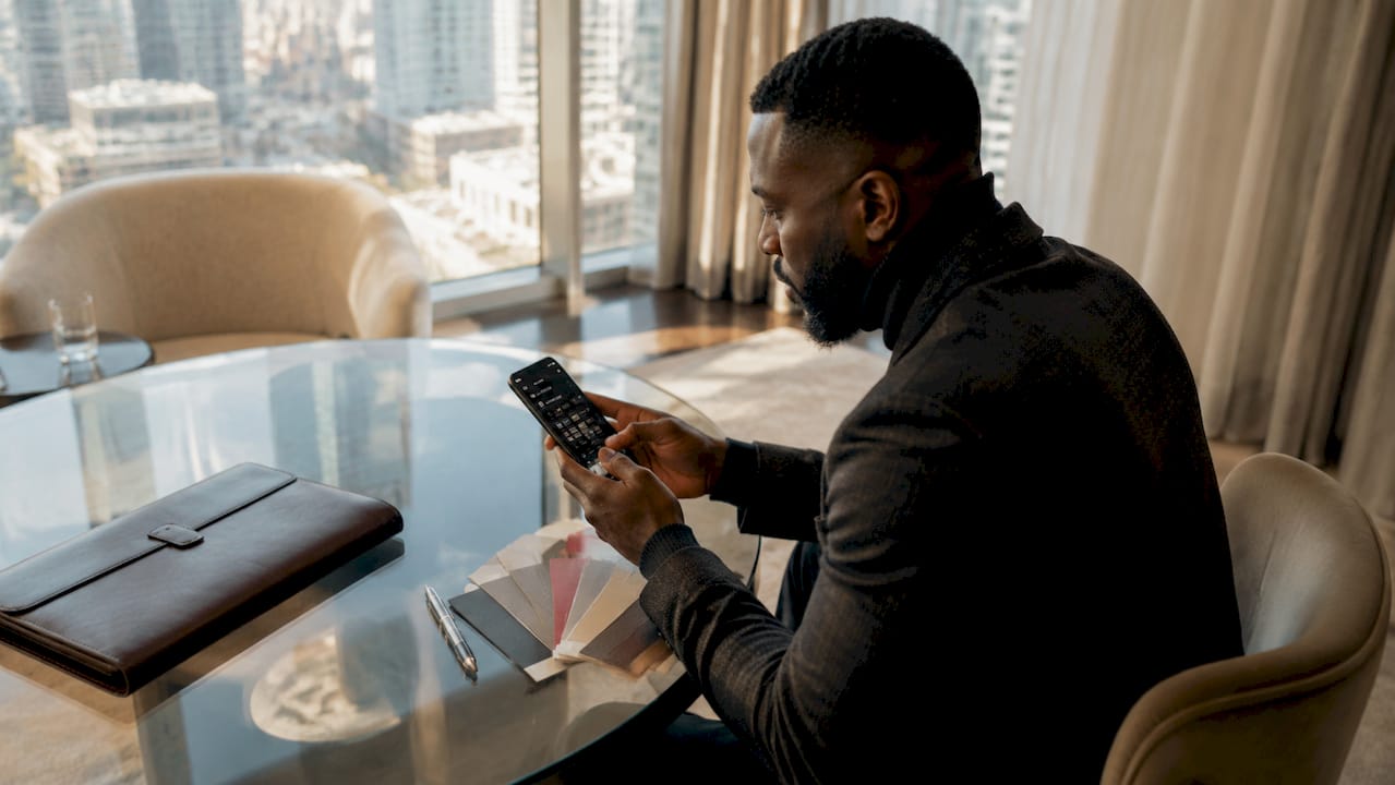 Fashion Customer Loyalty Tips for Luxury Brands in 2026 Hands scrolling loyalty rewards app on smartphone
