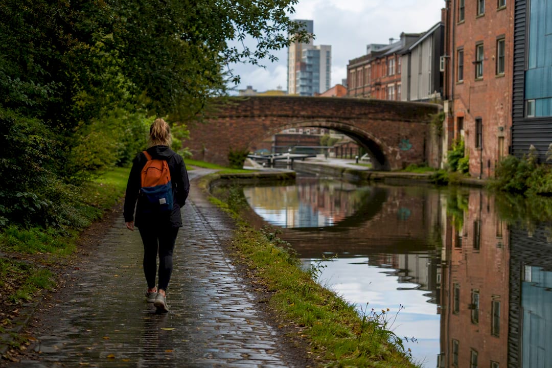 Walker beside Birmingham canal