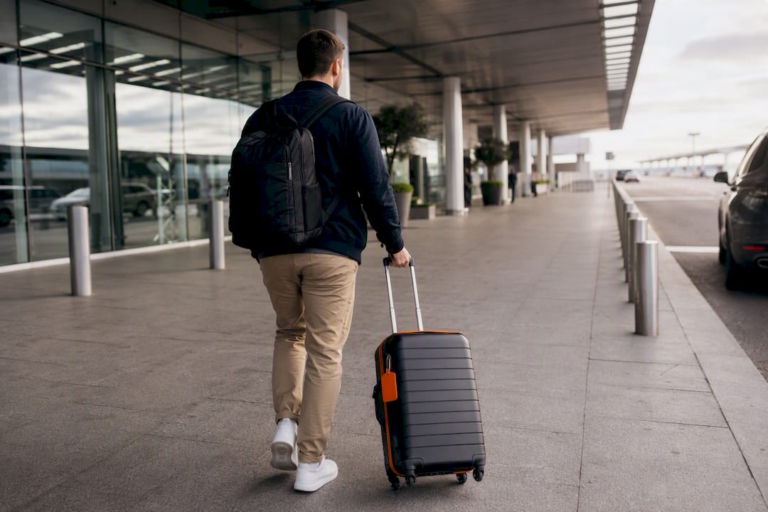 Traveler approaching airport pickup zone
