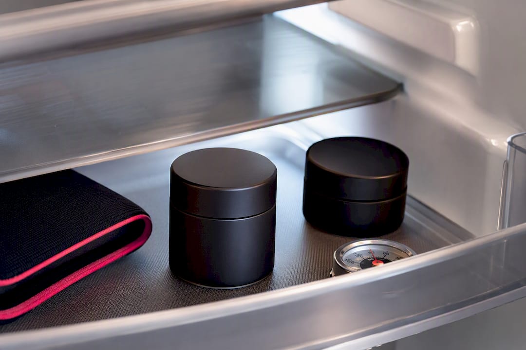 Opaque concentrate containers stored in cool darkness