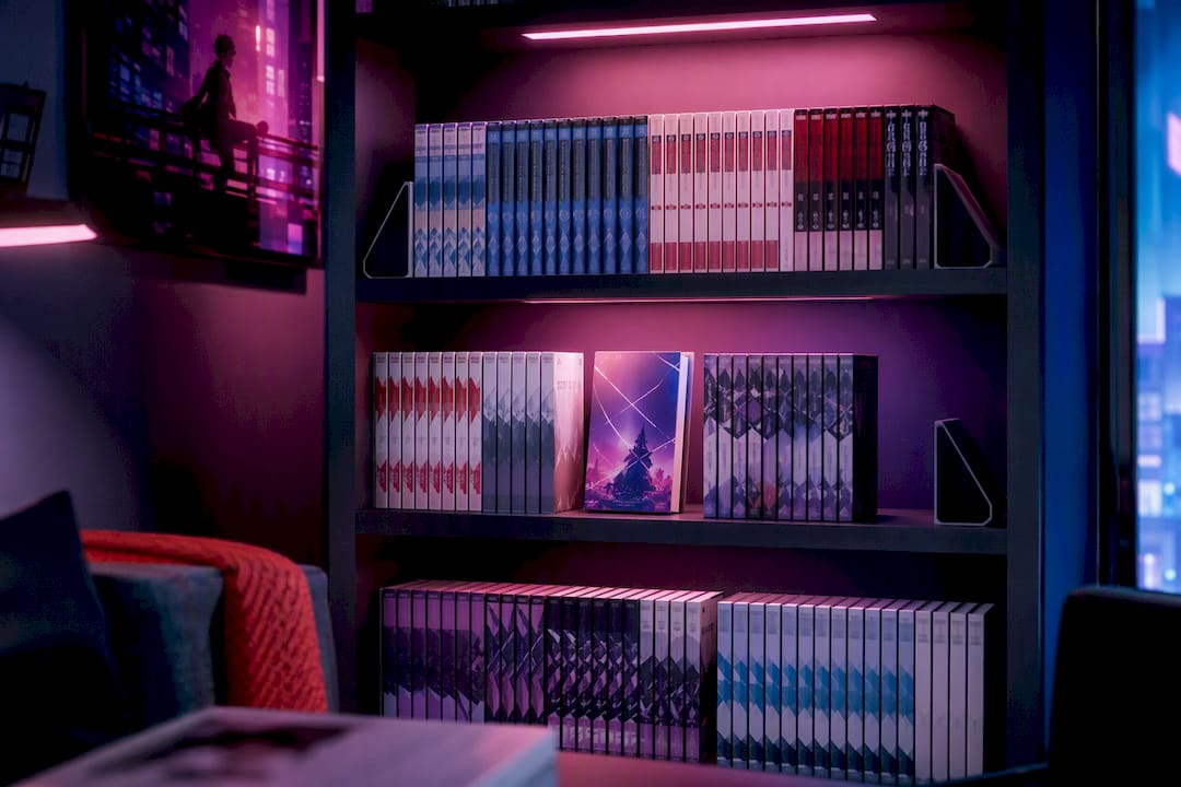 Organized manga volumes on a lit shelf