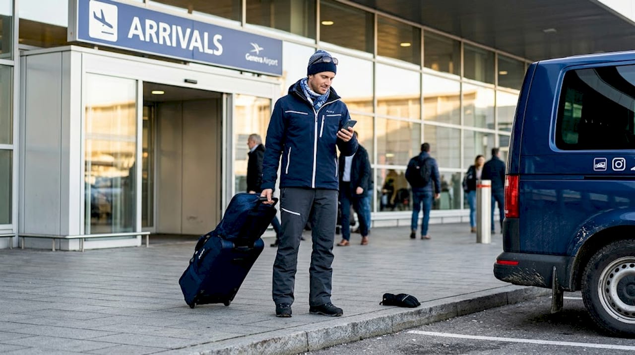 Traveller arriving at Geneva airport for ski trip