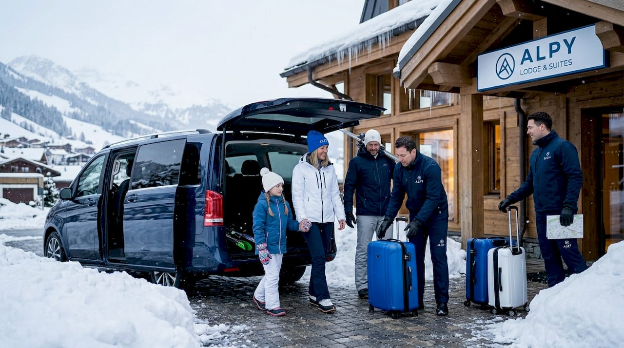 Family arriving by private transfer in snowy Val Thorens