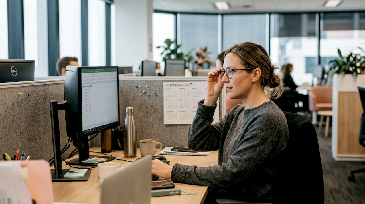 Woman adjusts comfortable acetate reading glasses