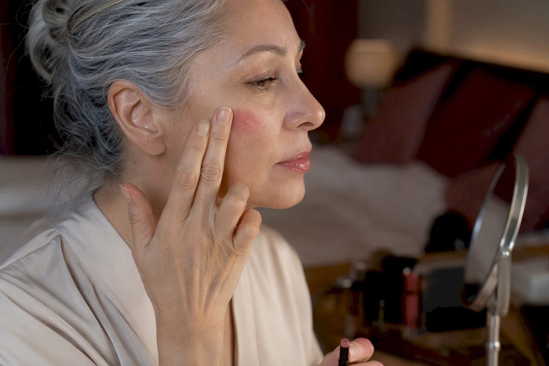 Fingertip blending cream blush on cheek