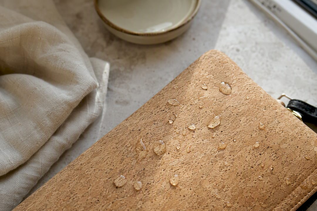 Water droplets beading on textured cork material