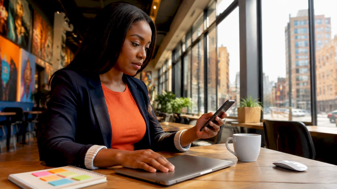 Focused digital marketing strategist working at home office desk
