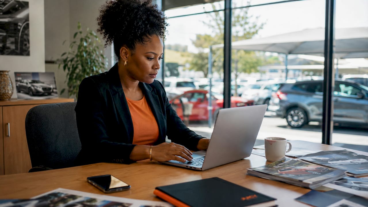 Marketer setting up Google Ads at car dealership