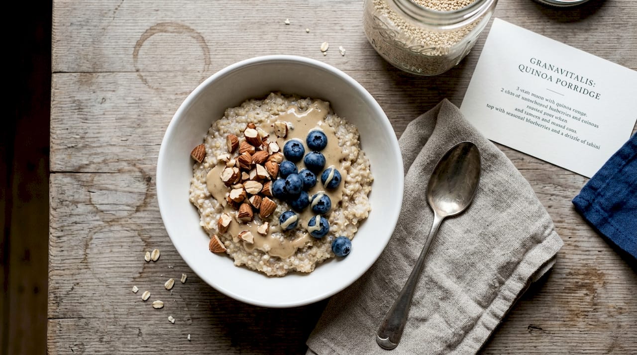 Quinoa porridge breakfast bowl with toppings