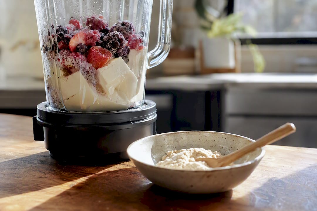 Blender preparing silken tofu protein smoothie