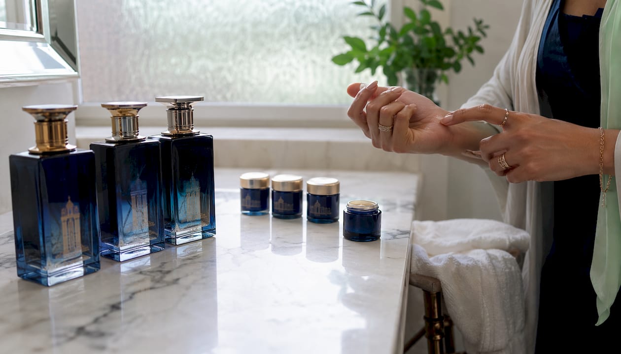 Overhead view of musky perfume layering setup