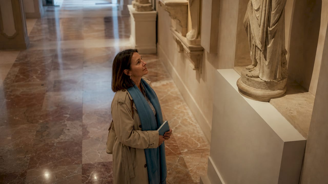 Visitor admiring art in empty off-season museum