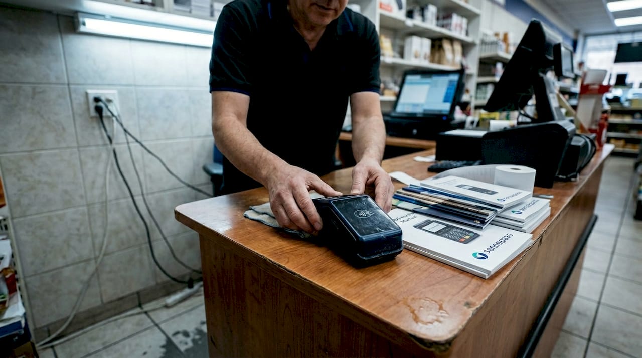 Manager sets up NFC terminal in store