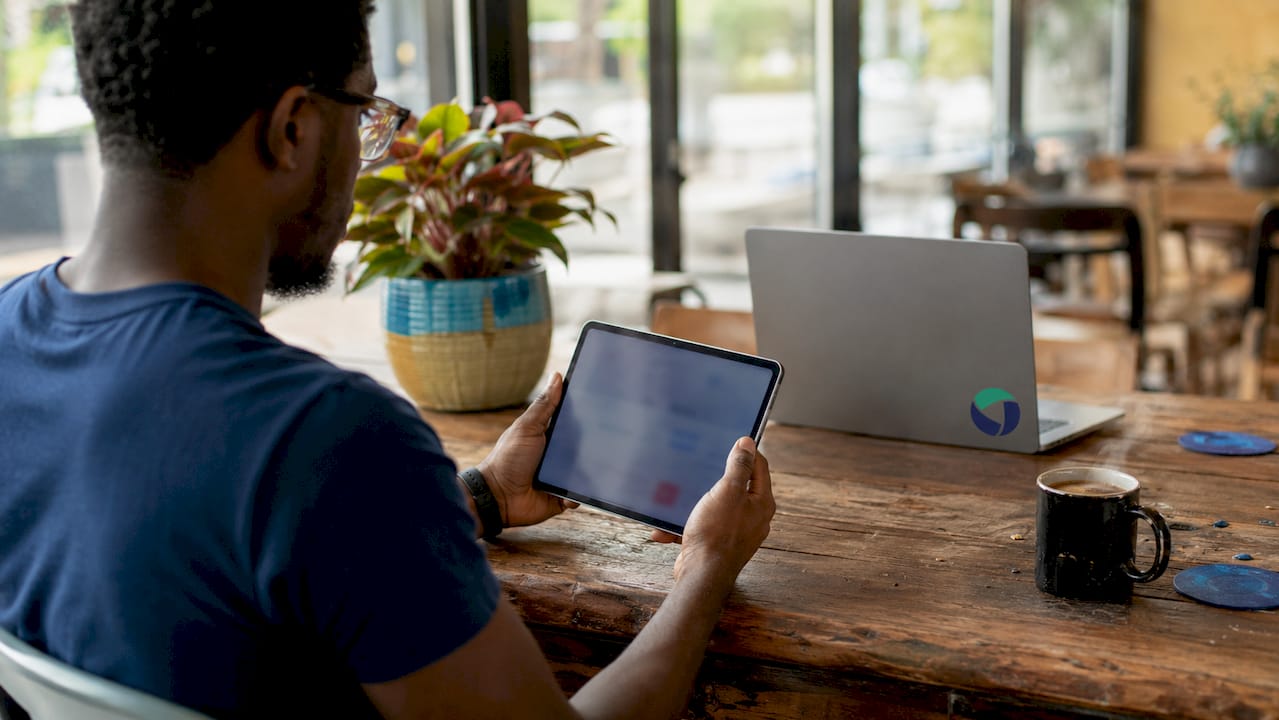 Hands holding tablet with payment gateway interface