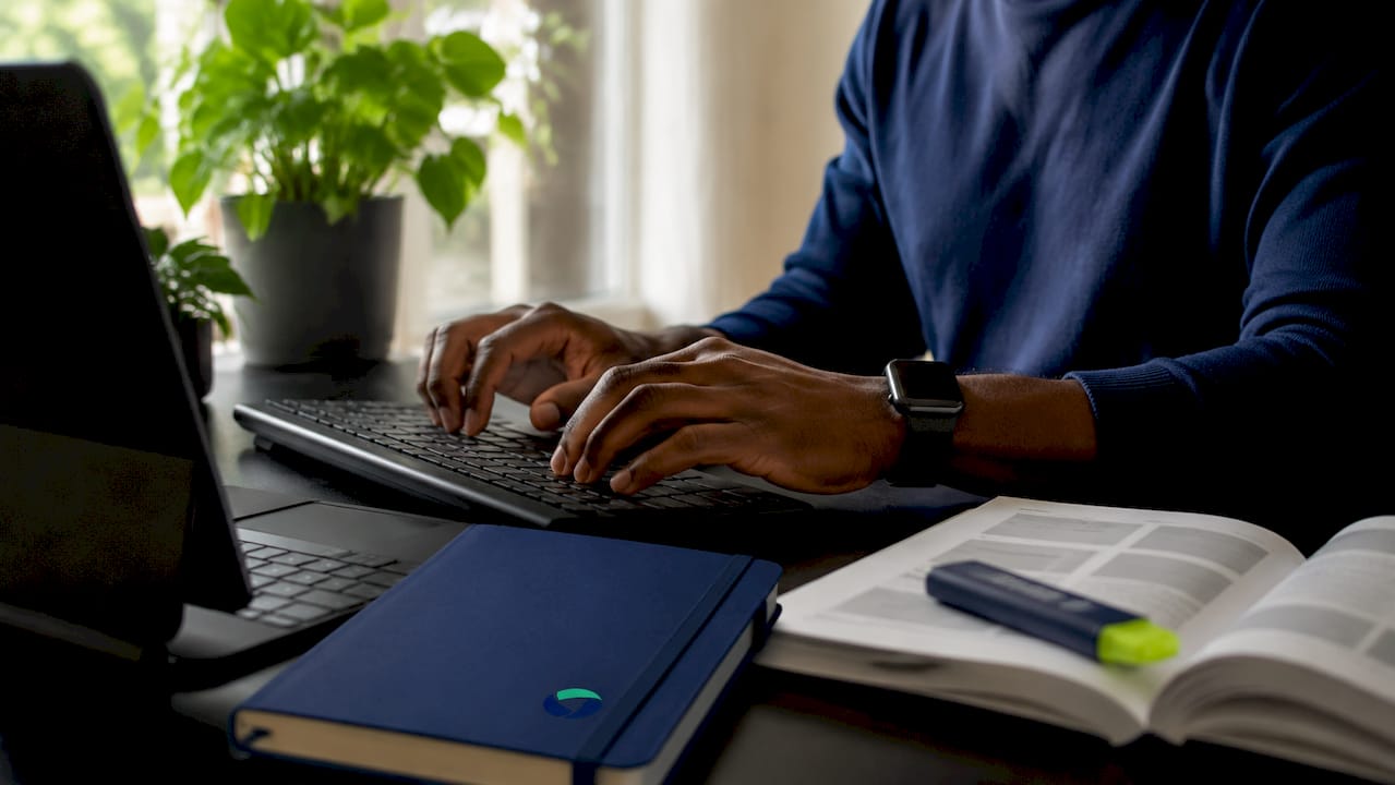 Hands typing financing software integration code