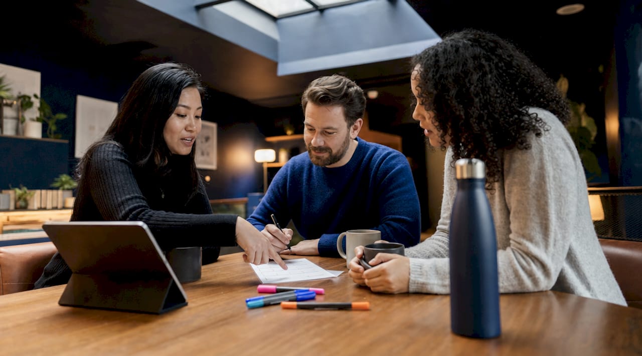Team reviewing pre-launch checklist in office