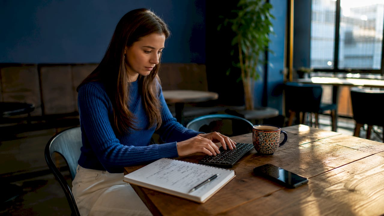 Hands typing and calculating sales velocity formula