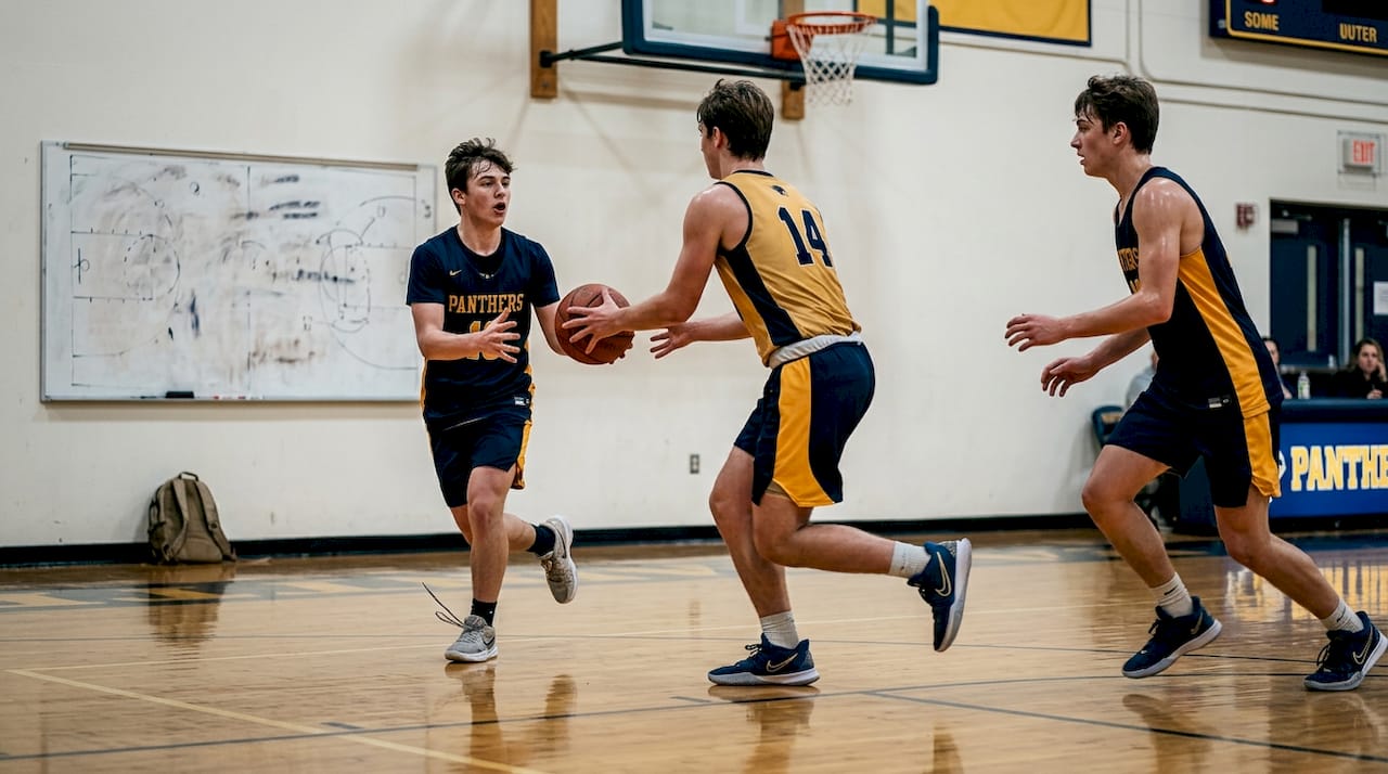 Players practice 3-man weave basketball drill