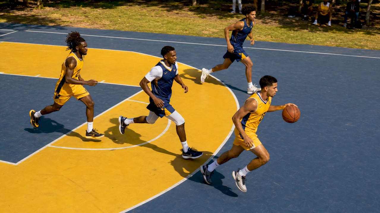 Team executing ball movement offense on court