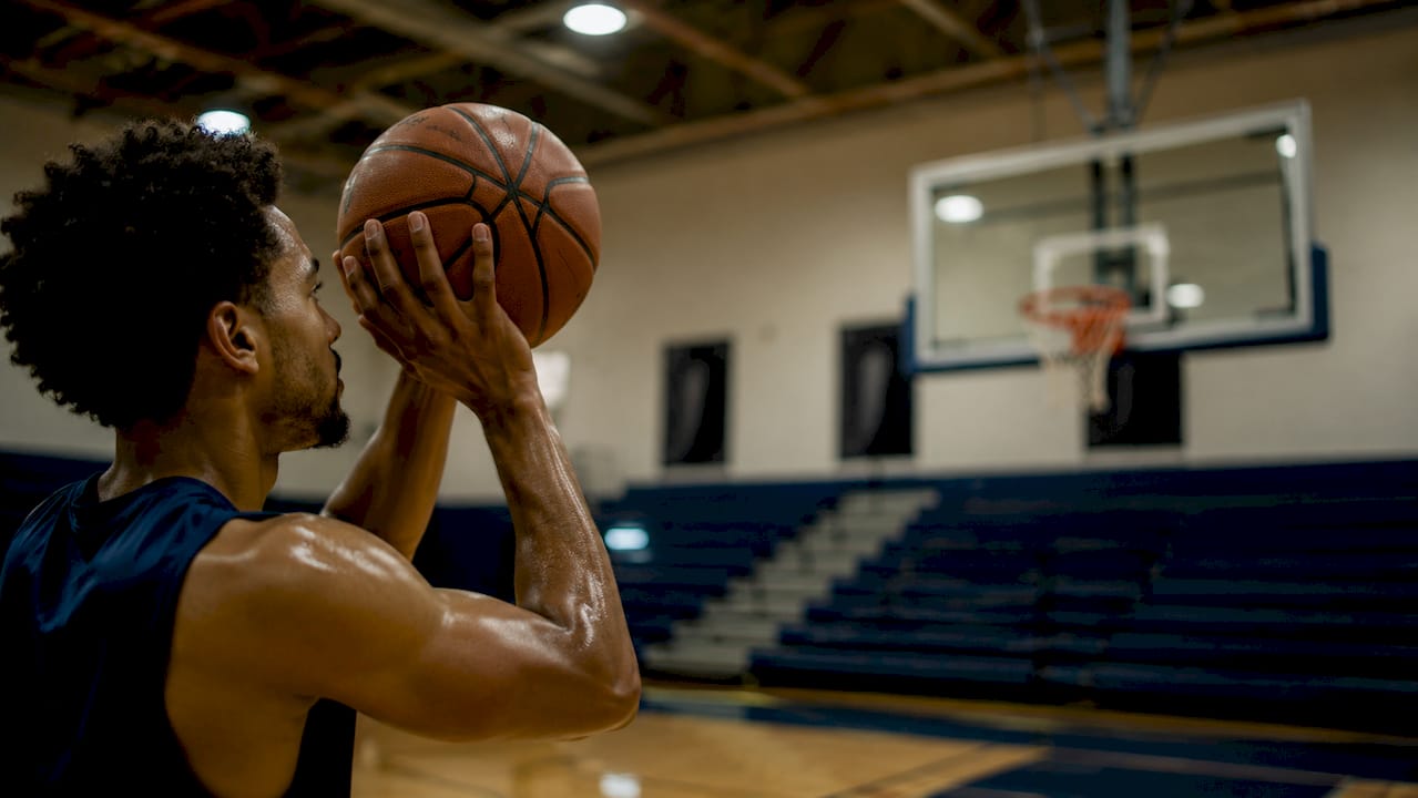 Close-up of basketball shooting elbow form
