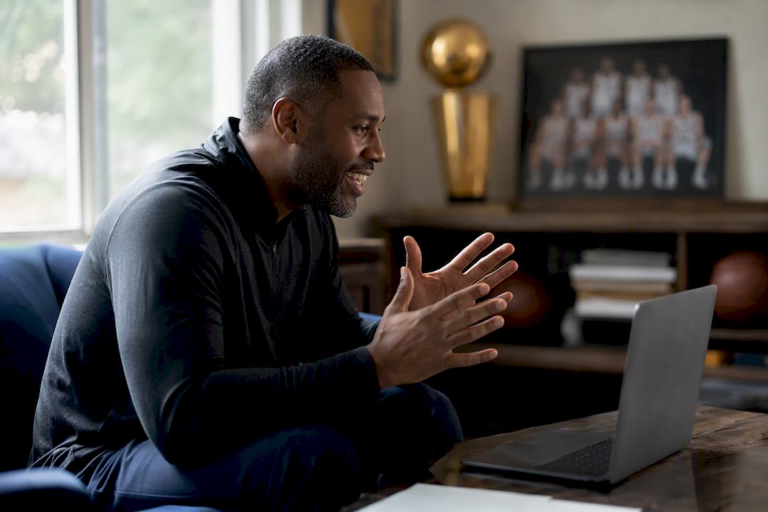 Coach giving positive feedback during virtual call